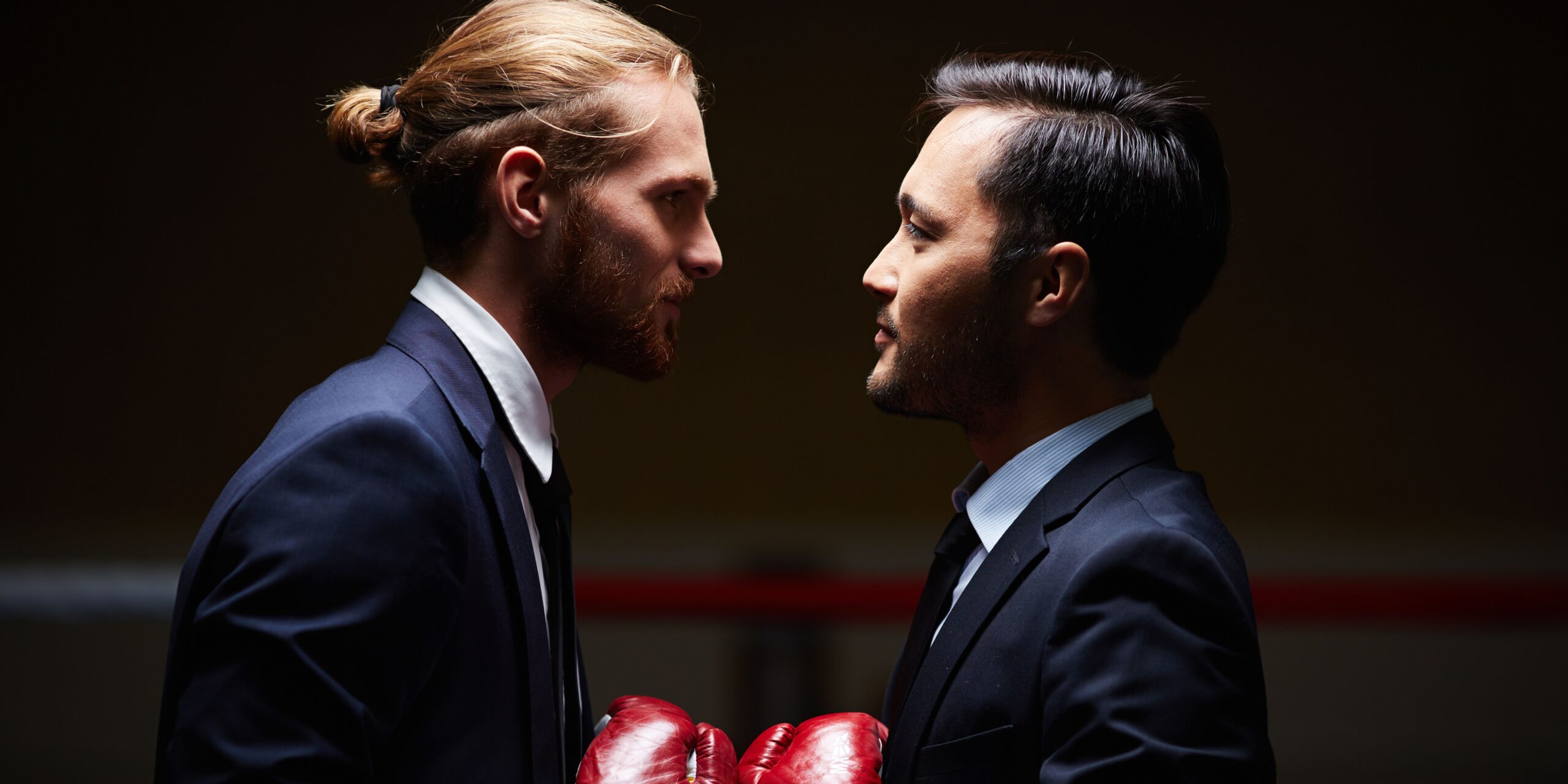 two lawyers with boxing gloves on ready to win the war for legal talent