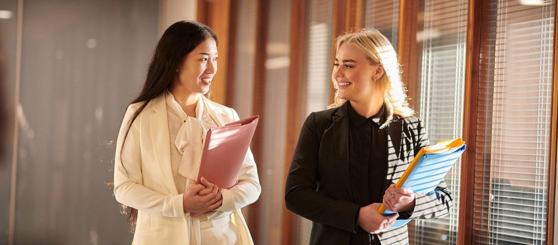 Australian Lawyers in conversation walking through office