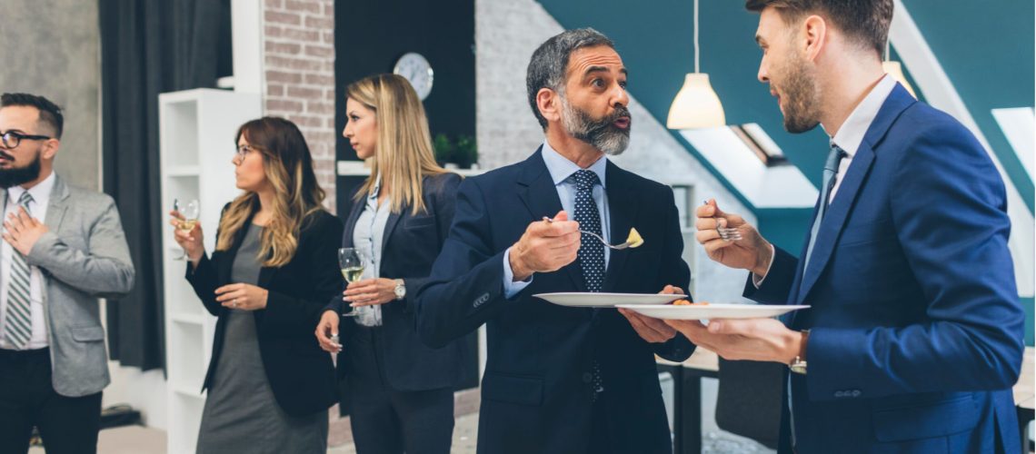 people mingling at an event - law firm alumni relationships